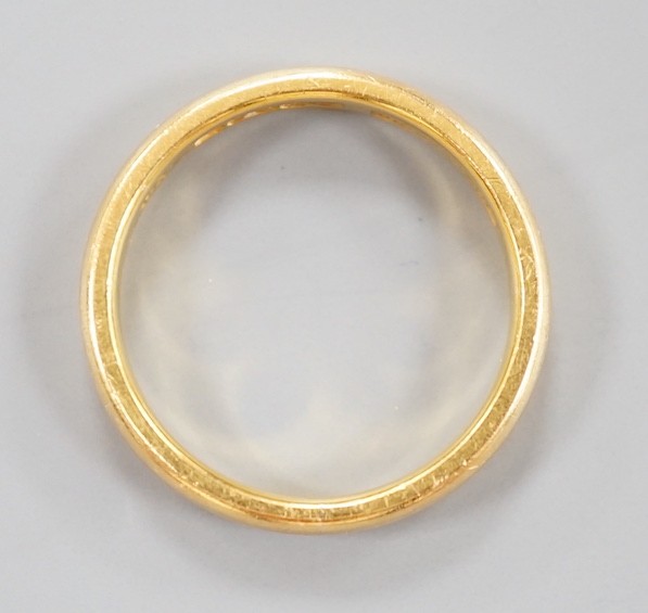 A 22ct gold wedding band, size K/L, 4.3 grams.